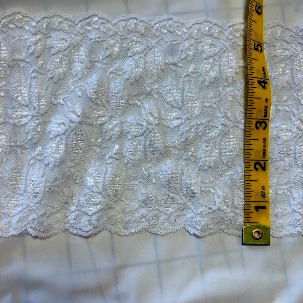New White roll of  stretch lace trim